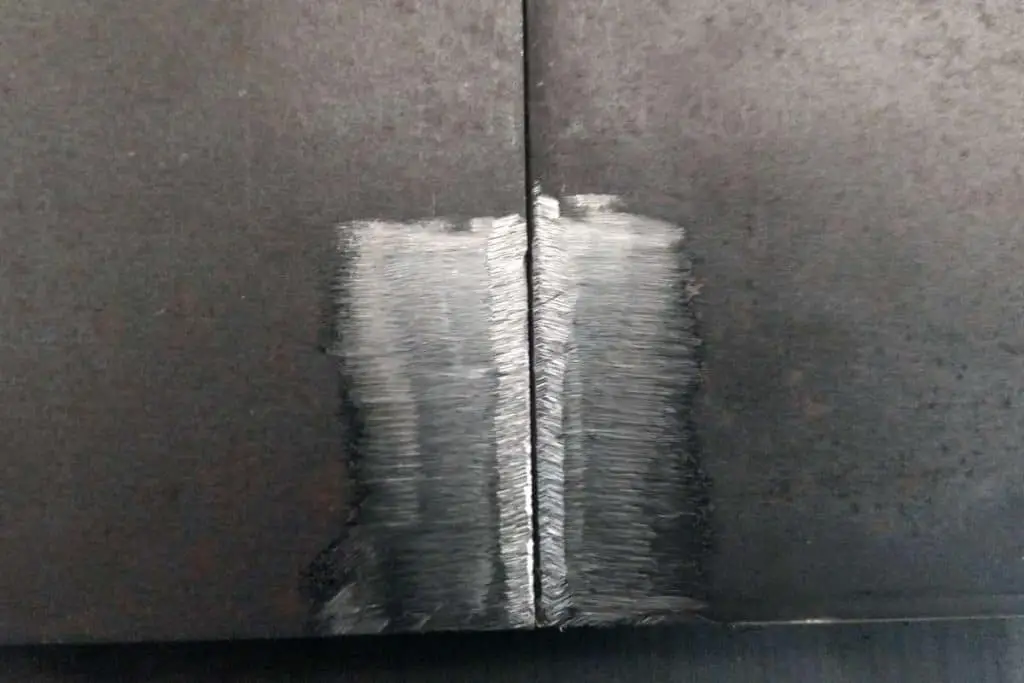 A photo of partially removed mill scale on hot-rolled mild steel