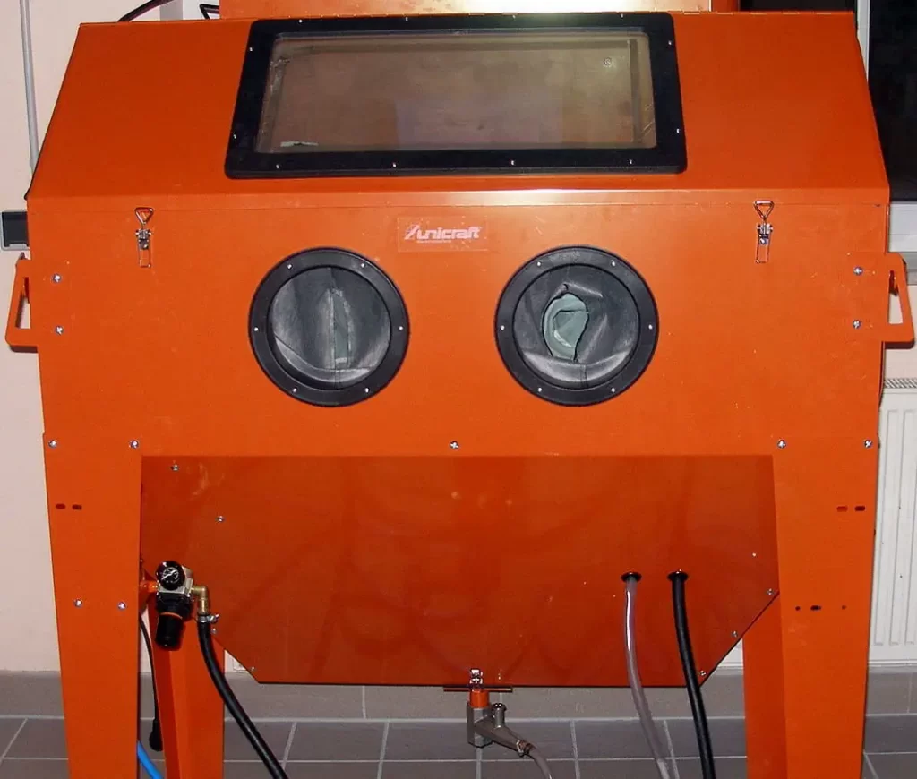 A photo of an abrasive blasting cabinet