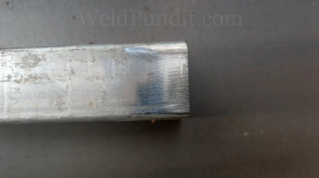 A photo of galvanized steel tubing cleaned with an angle grinder